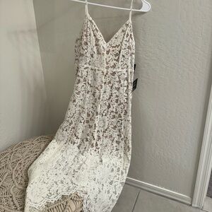 Lulus brand size small white midi length dress. New with tags never worn.